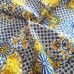 Stoffa con maiolica blu e sole giallo oro