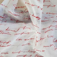 French curtain with red italic writing